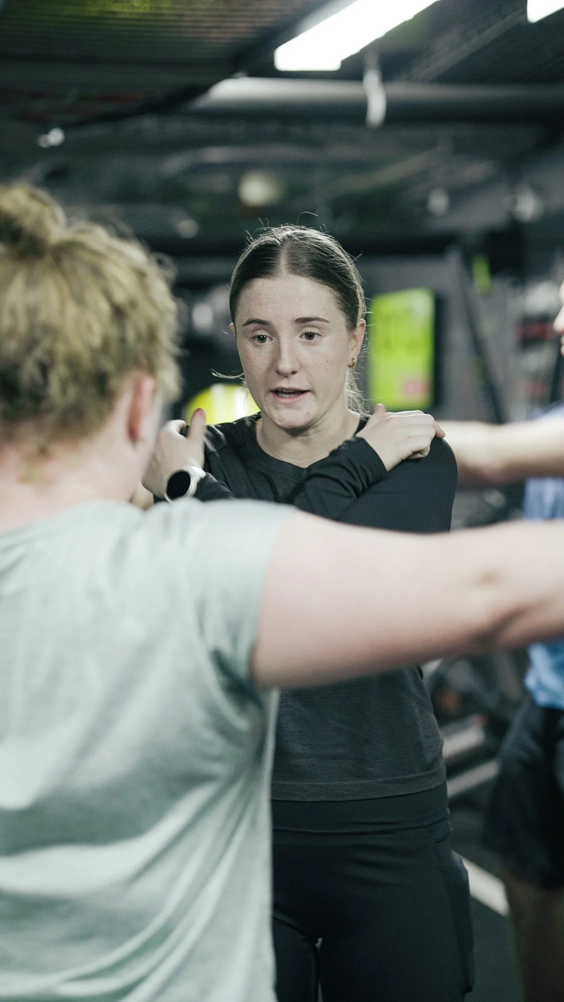 A coach demonstrating a movement