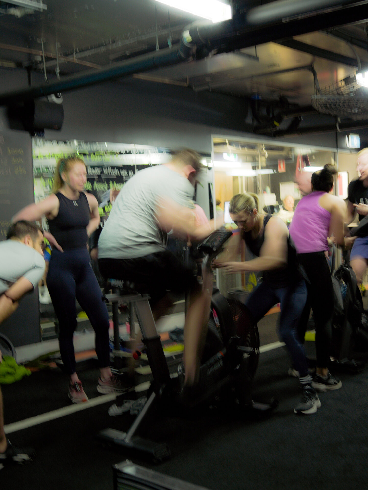 A packed floor mid-session, members working through the bikes