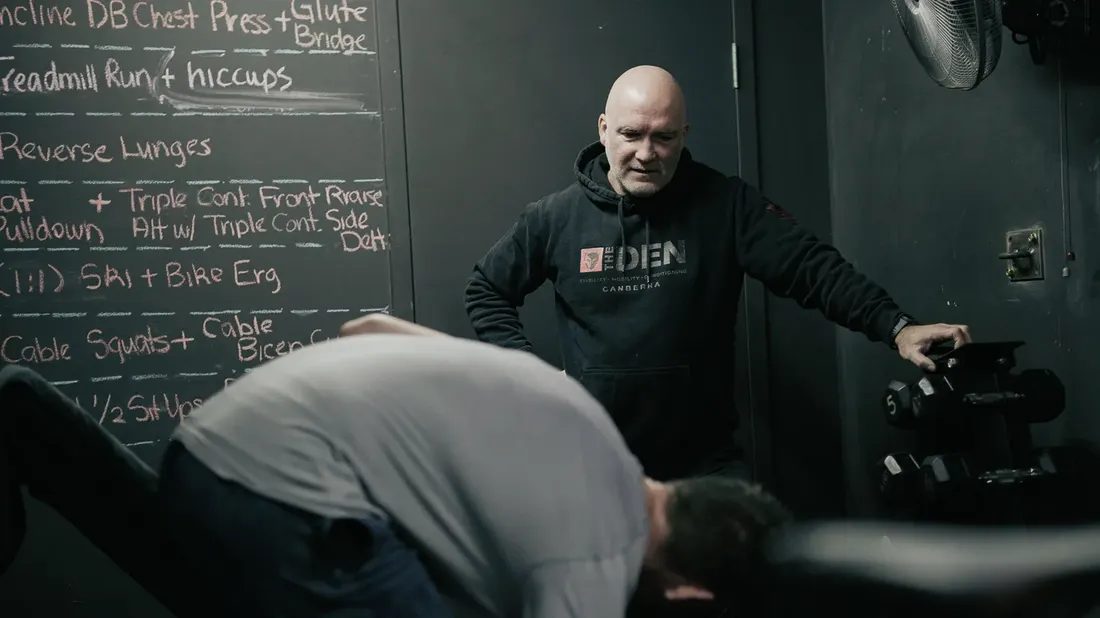 Mick Mackell coaching a member at The Den