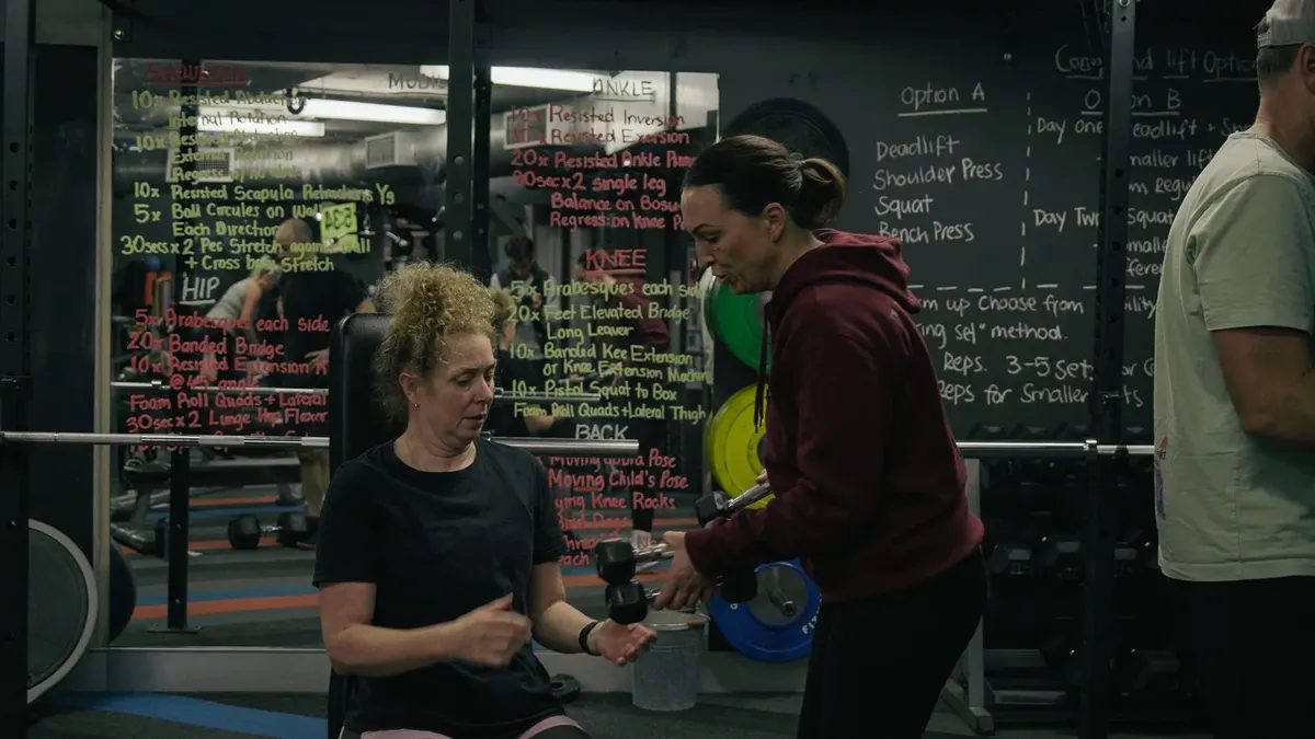 Nicole Wellington working one to one with a member