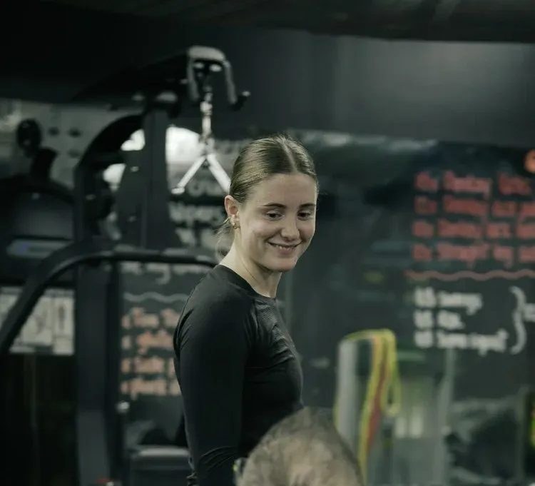Maddie, coach at The Den